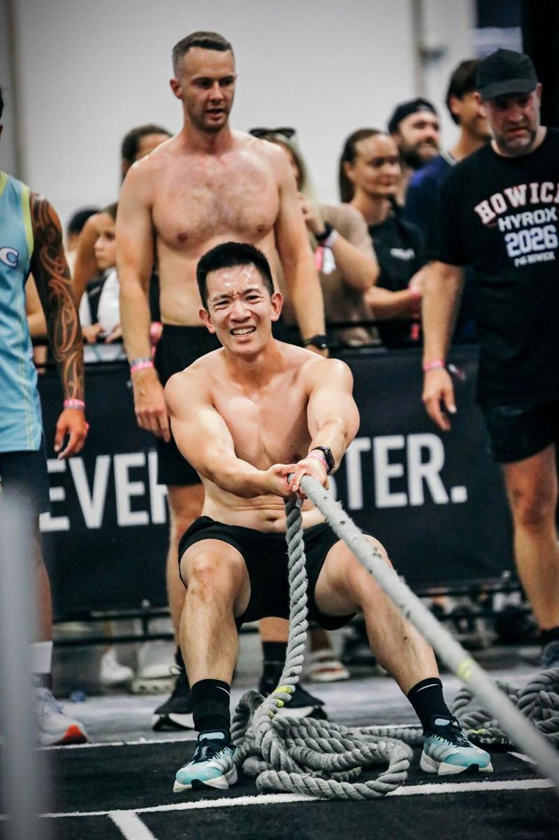 An M2 athlete pulling the sled rope at HYROX Auckland